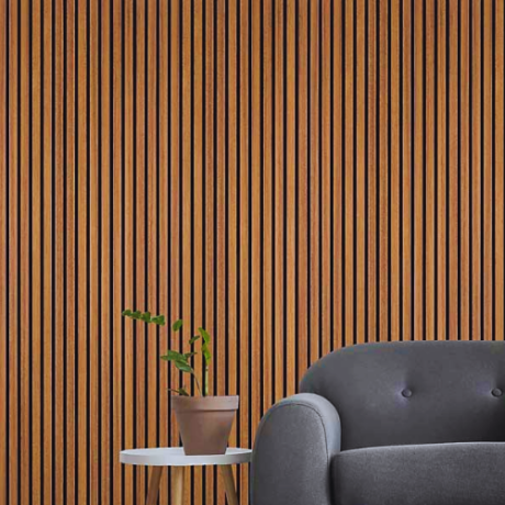 A cozy living room featuring oak wooden wall cladding and a stylish chair, creating a warm and inviting atmosphere.