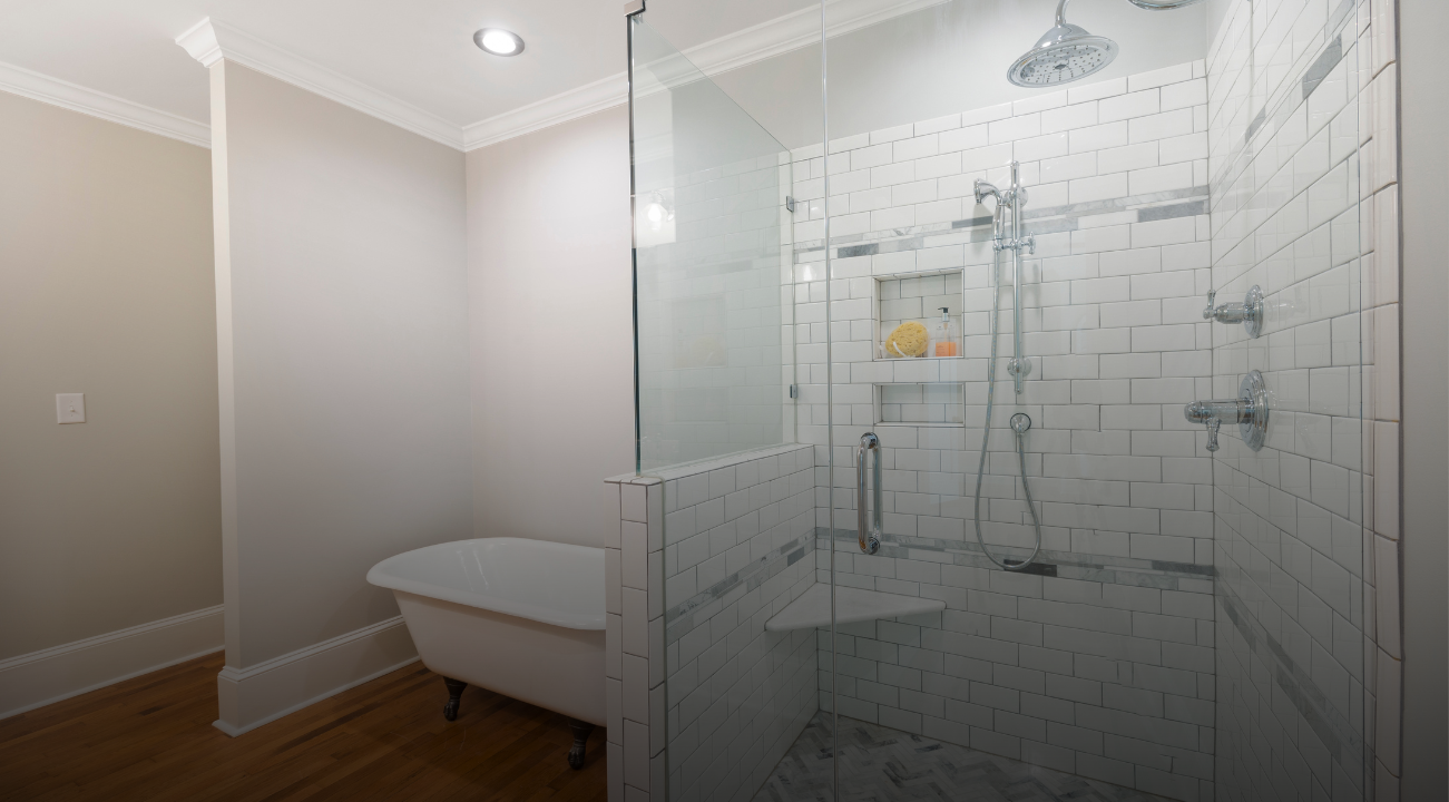 A modern bathroom featuring a shower and a tub, showcasing a stylish design and efficient use of space.